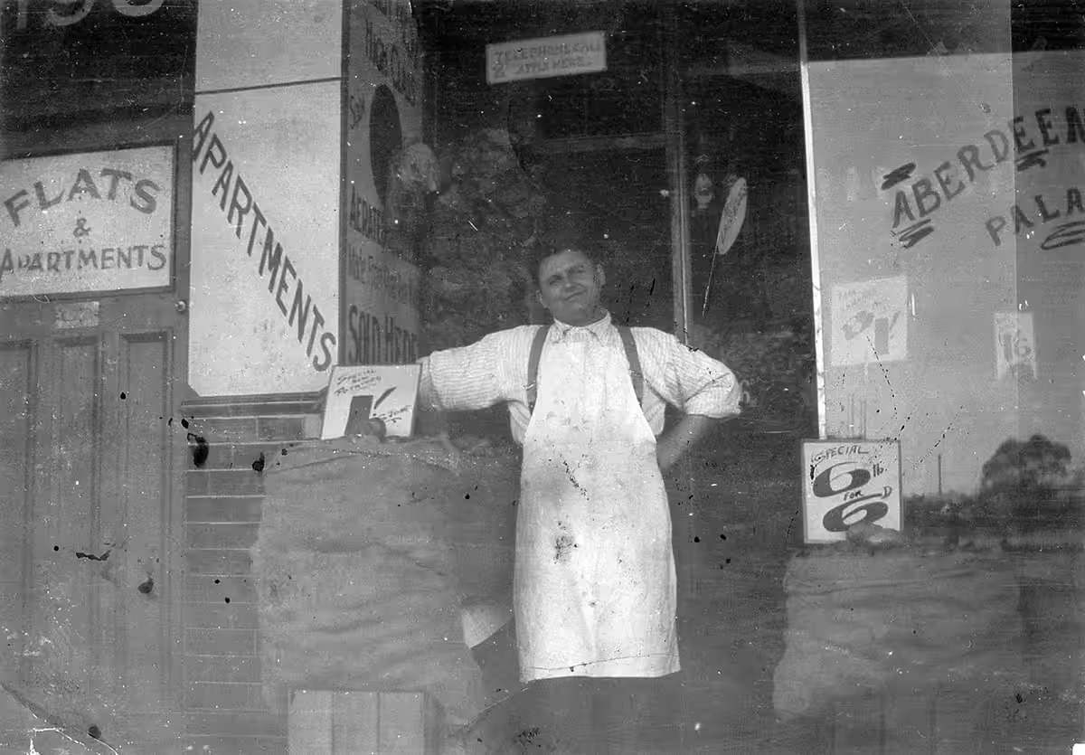 John Re outside his fruit and vegetable shop in Northbridge, 1930s
